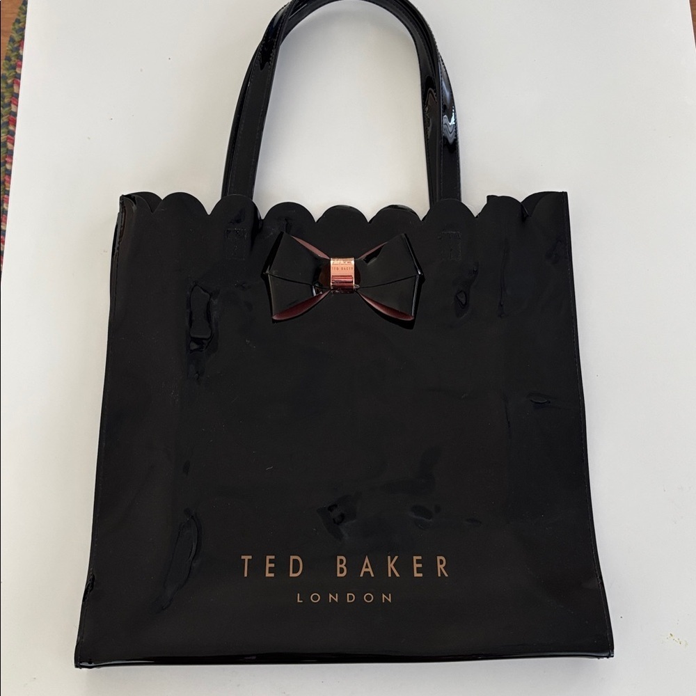 TED BAKER OF LONDON BLACK PATENT LEATHER SCALLOPED TOTE WITH BOW ACCENT